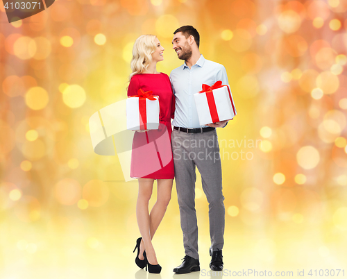 Image of happy couple with gift boxes