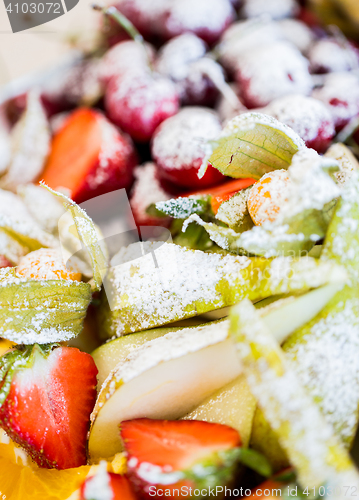 Image of close up of dish with sugared fruit dessert