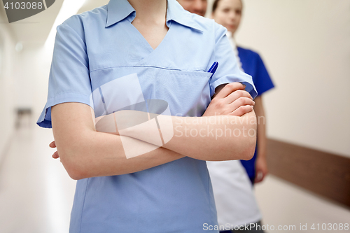 Image of close up of medics or doctors at hospital corridor