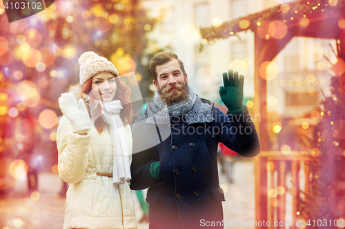 Image of happy couple walking in old town