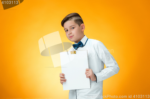 Image of The boy with tablet for notes