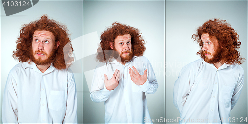 Image of Portrait of young man with shocked facial expression