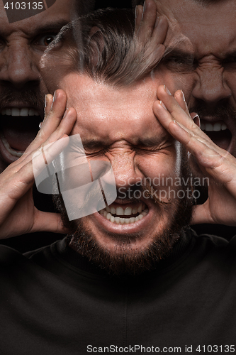 Image of Stressed businessman with a headache over black