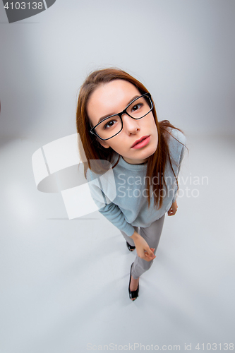 Image of The young business woman on gray background