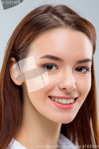 Image of The happy woman on gray background