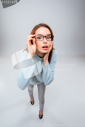 Image of The young business woman on gray background