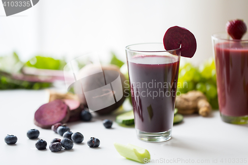 Image of glass of beetroot juice with fruits and vegetables