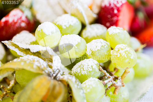 Image of close up of dish with sugared fruit dessert