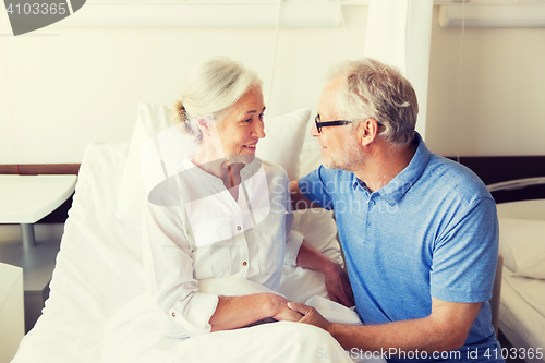 Image of senior couple meeting at hospital ward