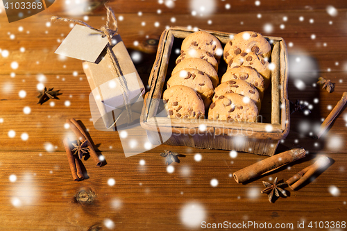 Image of close up of christmas oat cookies on wooden table