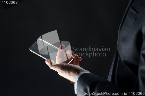 Image of close up of businessman with glass smartphone