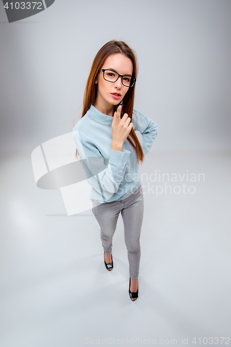 Image of The young business woman on gray background