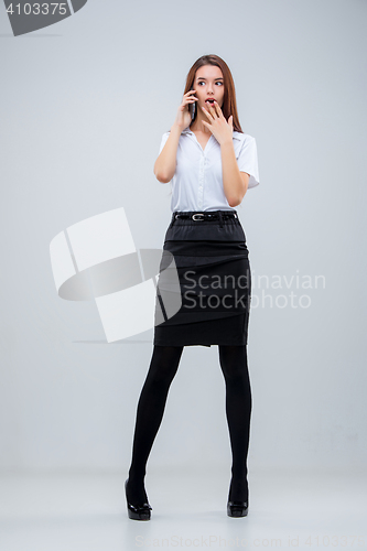 Image of The young business woman on gray background