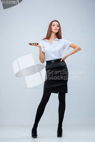 Image of The young business woman on gray background