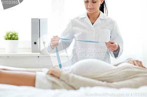 Image of close up of doctor and pregnant woman at hospital