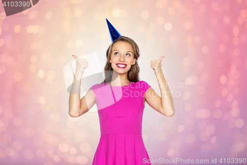 Image of happy young woman or teen girl in party cap