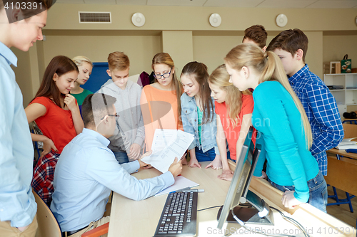 Image of group of students and teacher at school classroom