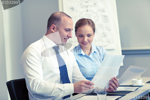 Image of smiling business people meeting in office