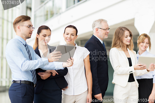 Image of business people with tablet pc computers at office