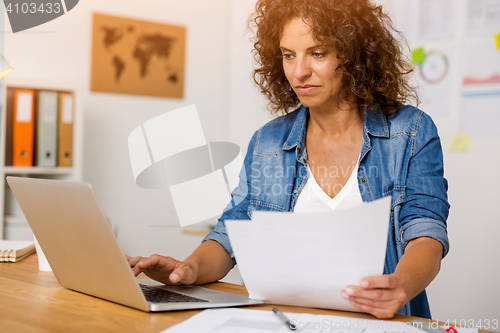 Image of Woman working at the office