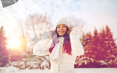 Image of happy woman outdoors in winter