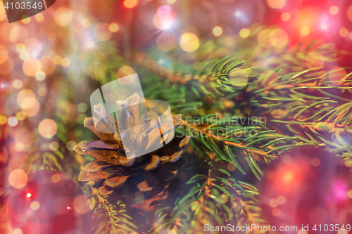 Image of fir branch with christmas ball and pinecone