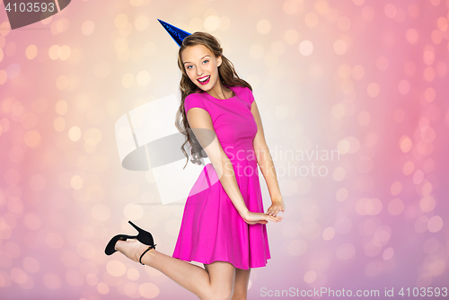 Image of happy young woman or teen girl in party cap