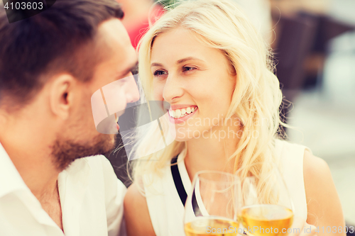 Image of happy couple clinking glasses at restaurant lounge