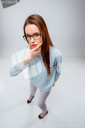 Image of The young business woman on gray background