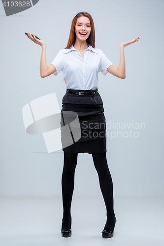 Image of The young business woman on gray background