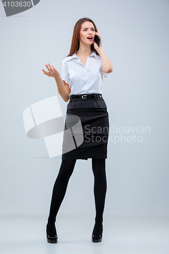 Image of The young business woman on gray background