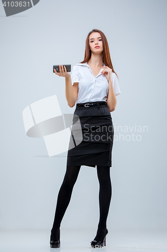 Image of The young business woman on gray background