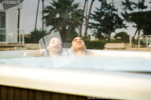 Image of Young couple in a jacuzzi