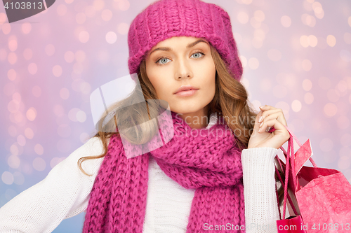 Image of beautiful young woman with shopping bags