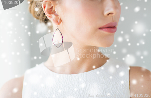 Image of close up of beautiful woman face with earring