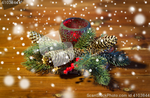 Image of christmas fir branch decoration and candle lantern