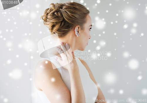 Image of close up of beautiful woman with ring and earring