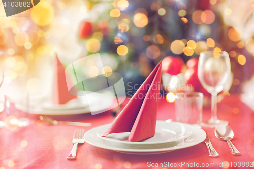 Image of room with christmas tree and decorated table