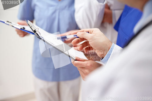 Image of close up of doctors with clipboard at hospital