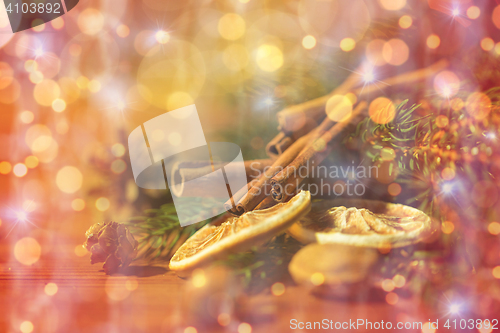 Image of christmas fir branch, cinnamon and dried orange