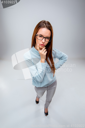 Image of The young business woman on gray background