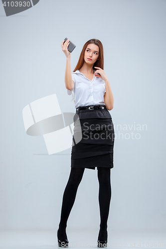 Image of The young business woman on gray background