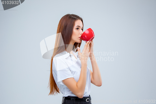 Image of The young business woman on gray background