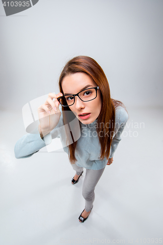 Image of The young business woman on gray background