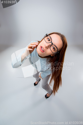 Image of The young business woman on gray background