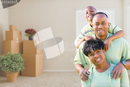 Image of African American Family In Room with Packed Moving Boxes