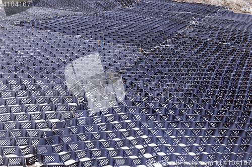 Image of fence for sand, close-up