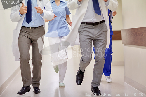 Image of close up of medics or doctors running at hospital