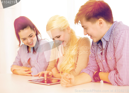 Image of smiling students with tablet pc computer at school