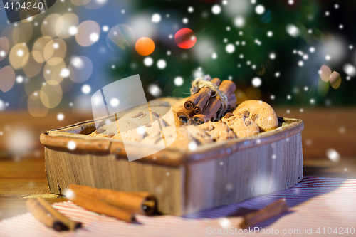 Image of close up of christmas oat cookies on wooden table